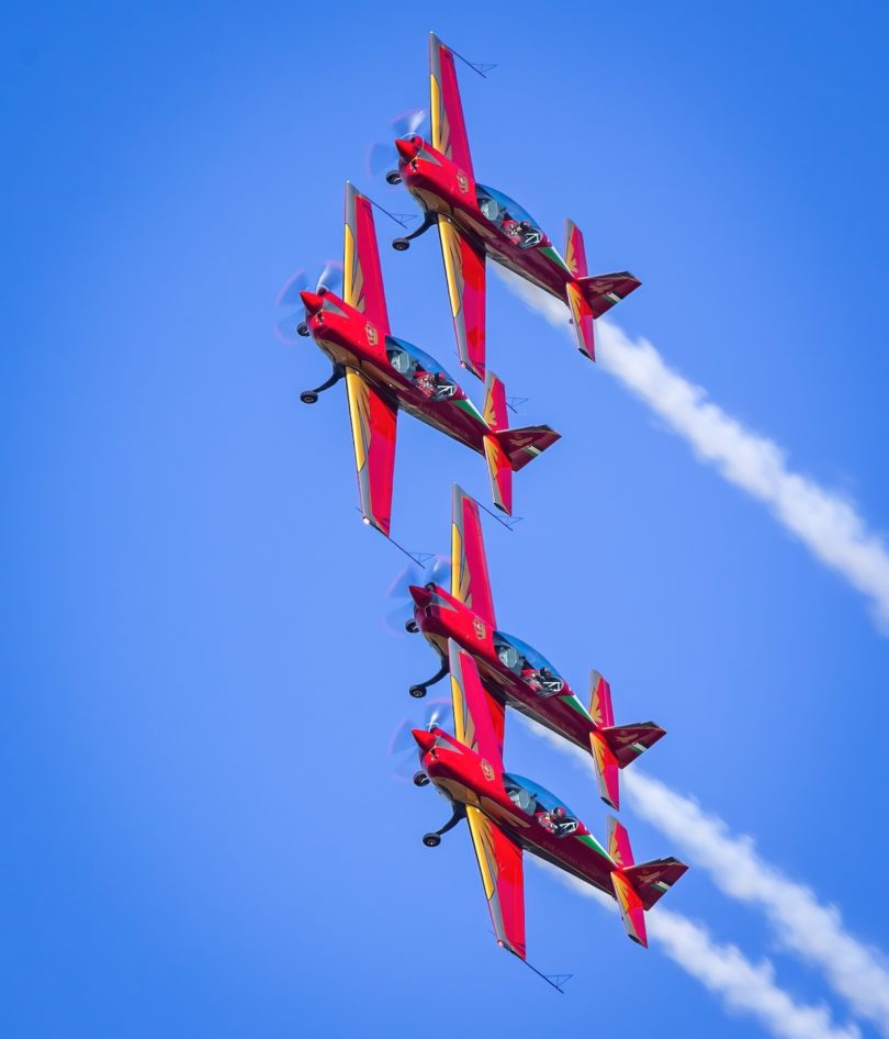a group of airplanes flying in the sky