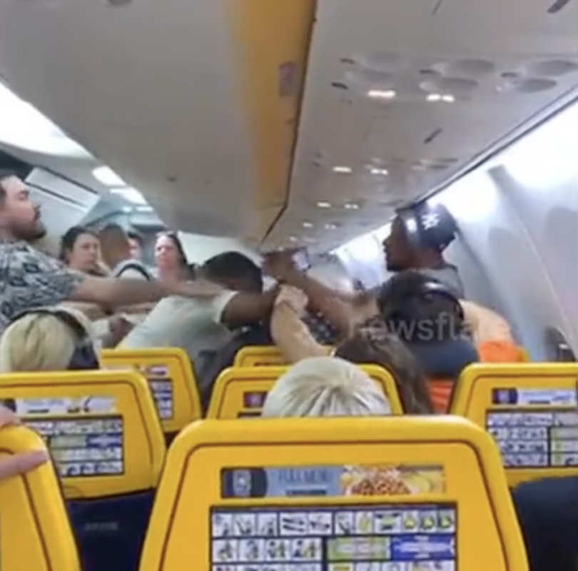 people on an airplane with people around them