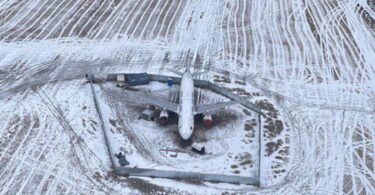 an airplane in a snowy field