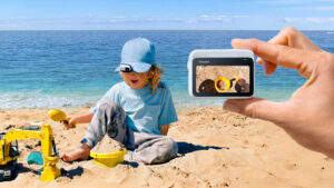 a person playing with sand on the beach