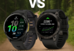The image shows two Garmin smartwatches against a blurred forest background. On the left is the Garmin Forerunner 970, displaying time, date, and various metrics. On the right is the Garmin Epix Pro, showing current elevation and a graph. The word "VS" is positioned between the watches, indicating a comparison.