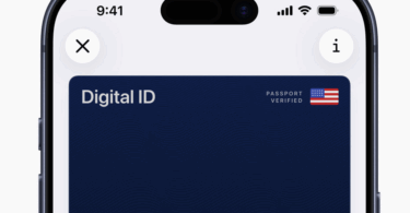 The image shows a smartphone screen displaying a digital ID card. The card is dark blue with the text "Digital ID" and "Kelly G." on it. There is a small American flag icon with the words "Passport Verified" next to it. The phone's status bar shows the time as 9:41, with icons for signal strength, Wi-Fi, and battery. There are also circular icons for closing and information at the top corners of the screen.