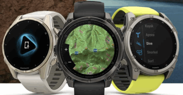The image shows three Garmin smartwatches with different displays. The left watch has a charging icon on its screen, the middle watch displays a topographic map, and the right watch shows a menu with options like "Kayak," "Apnea," "Dive," "Snorkel," and "Surf." The watches have different band colors: white, black, and yellow. The background features a rocky surface and a scenic view of a lake with hills.