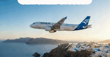 an airplane flying over a town