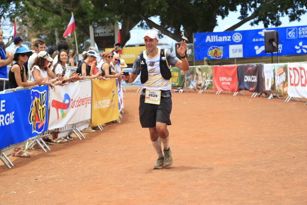 a man running on a dirt track