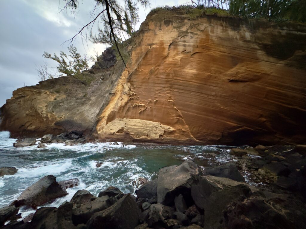 a river flowing through a rocky cliff