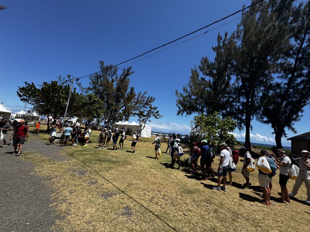a group of people standing on grass