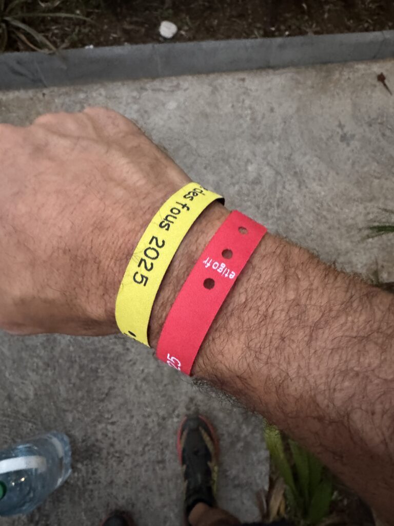 a wrist with a yellow and red wristbands