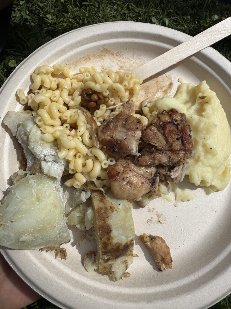 a plate of food with a wooden spoon