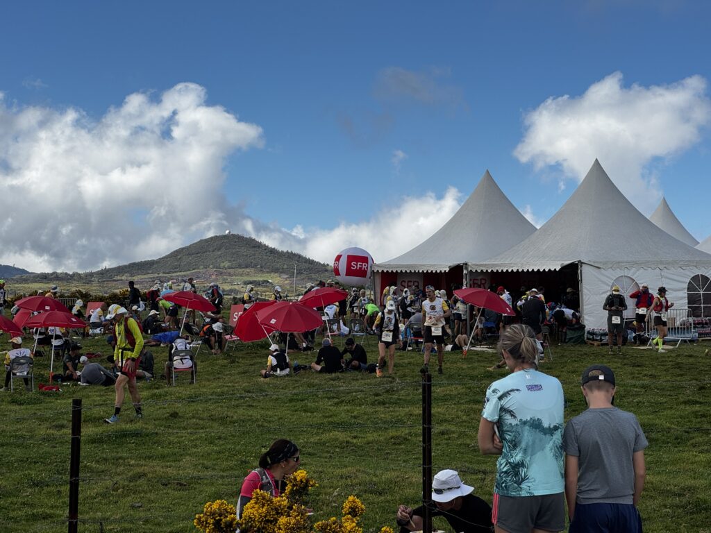 a group of people in a field with tents