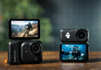 The image shows two action cameras placed on a wooden surface. The camera on the left has a screen displaying a person mountain biking on a rocky trail with mountains in the background. The camera on the right shows a screen with a person scuba diving underwater. Both cameras have lenses prominently visible, and the background is blurred.
